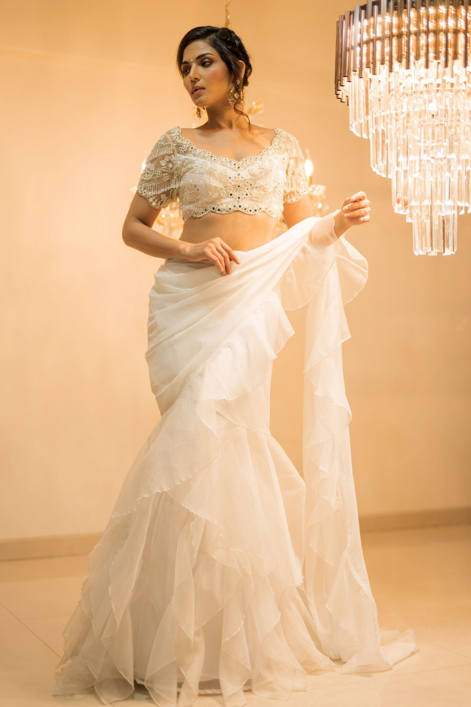 https://www.agashestore.com/cdn/shop/files/Forampatel-WhiteOrganzaPre-DrapedRuffleSareeSetwithBelt1.jpg?v=1751303844&width=1500
