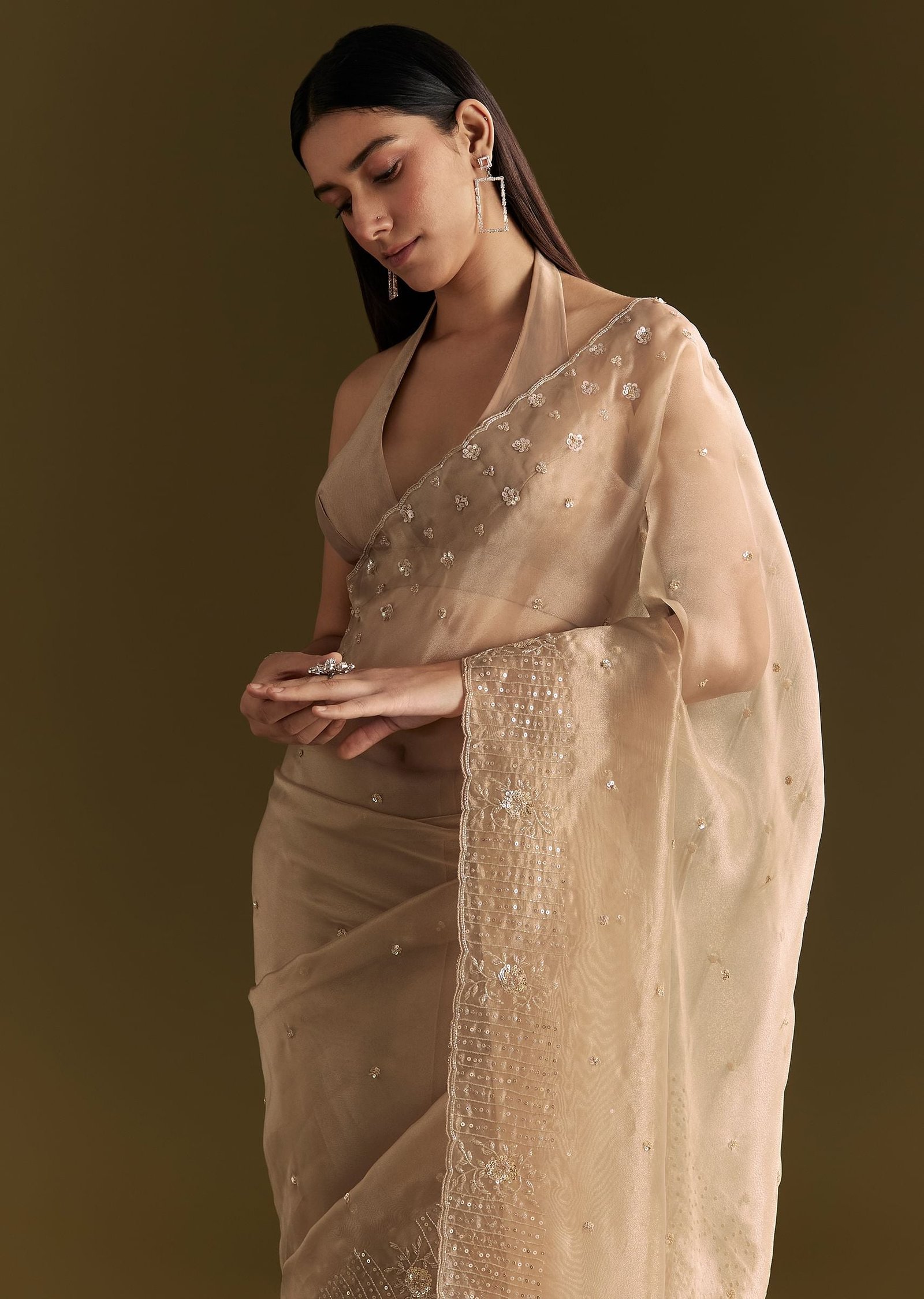 https://in.kalkifashion.com/cdn/shop/files/beige-organza-sequin-embroidered-saree-with-scallop-border-sg293913-1.jpg?v=1742887313