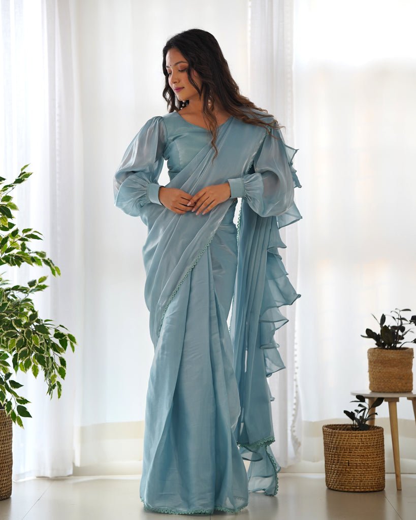 https://clothsvilla.com/cdn/shop/files/sky-blue-premium-ready-to-wear-jimmy-choo-organza-ruffle-saree-with-stitched-blouse_6_1024x1024.jpg?v=1737709565